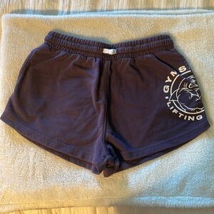 Purple gym shark legacy shorts.